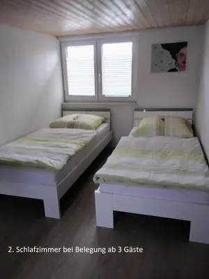 Ein Bett oder Betten in einem Zimmer der Unterkunft Ferienwohnung Schreiberstraße