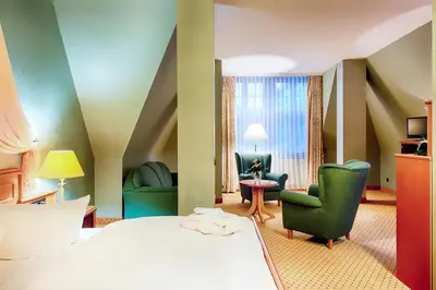 Ein Bett oder Betten in einem Zimmer der Unterkunft Hotel Villa Heine Wellness & Spa