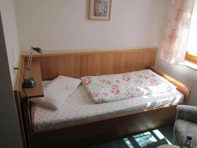 Ein Bett oder Betten in einem Zimmer der Unterkunft Hotel Pension Am Kurzentrum