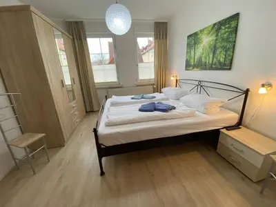 Ein Bett oder Betten in einem Zimmer der Unterkunft Ferienwohnung am Anger