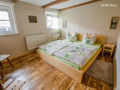 Ein Bett oder Betten in einem Zimmer der Unterkunft Holz und Fein am Burgberg