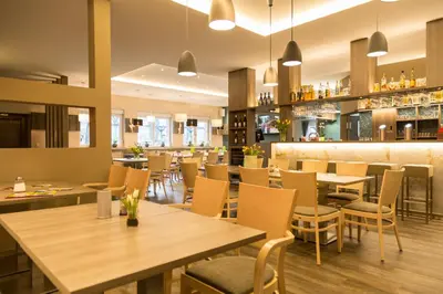 Ein Restaurant oder anderes Speiselokal in der Unterkunft Sporthotel Wernigerode