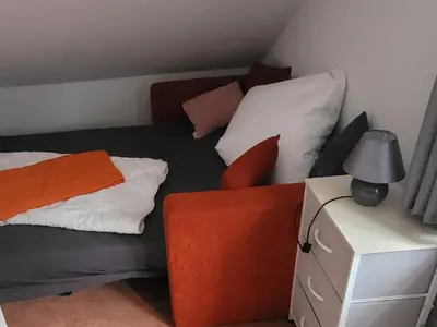 Ein Bett oder Betten in einem Zimmer der Unterkunft Ferienwohnung LUNA Haus Sachsensteinblick, Wohnung über 2 Etagen