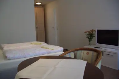 Ein Bett oder Betten in einem Zimmer der Unterkunft Gästehaus Verhoeven
