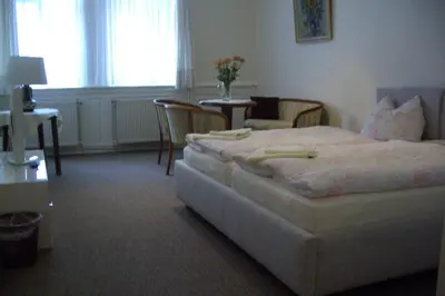 Ein Bett oder Betten in einem Zimmer der Unterkunft Gästehaus Verhoeven