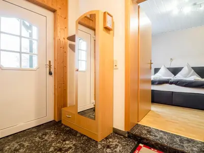 Ein Bett oder Betten in einem Zimmer der Unterkunft Ruhiges Apartment am Waldrand mit Schlossblick