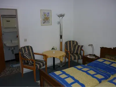 Ein Bett oder Betten in einem Zimmer der Unterkunft Hotel Hecker