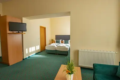 Ein Bett oder Betten in einem Zimmer der Unterkunft Ferien Hotel Villa Südharz