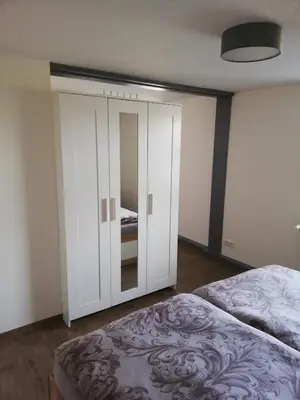 Ein Bett oder Betten in einem Zimmer der Unterkunft FeWo Königstein