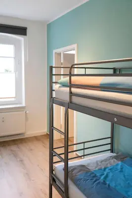 Ein Bett oder Betten in einem Zimmer der Unterkunft Harzquartier
