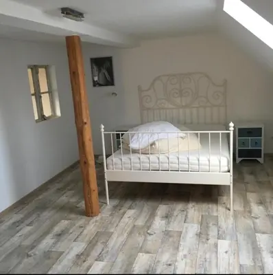 Ein Bett oder Betten in einem Zimmer der Unterkunft Ferienhof Drei Linden