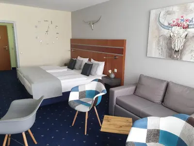 Ein Bett oder Betten in einem Zimmer der Unterkunft Apartment am Kranichsee Vier Jahreszeiten