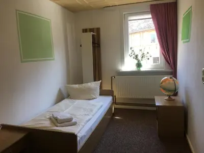 Ein Bett oder Betten in einem Zimmer der Unterkunft Harz House