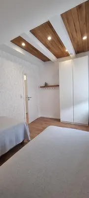 Ein Bett oder Betten in einem Zimmer der Unterkunft Ferienwohnung am Wald