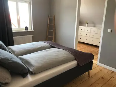 Ein Bett oder Betten in einem Zimmer der Unterkunft Villa Hanne mit Garten