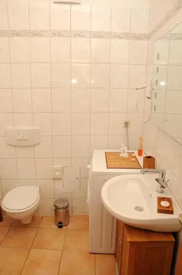 Ein Badezimmer in der Unterkunft Apartments am Brunnen