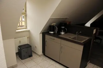 Küche/Küchenzeile in der Unterkunft Apartments am Brunnen