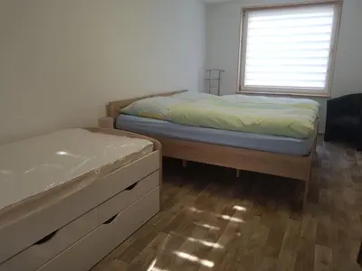 Ein Bett oder Betten in einem Zimmer der Unterkunft Ferienhaus Am Graseberg