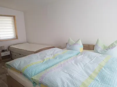 Ein Bett oder Betten in einem Zimmer der Unterkunft Ferienhaus Am Graseberg
