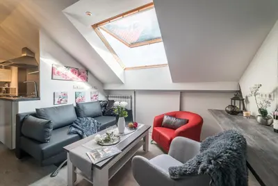 Ein Sitzbereich in der Unterkunft mountain-view-apartments de