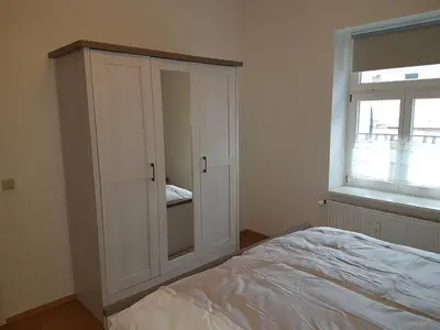 Ein Bett oder Betten in einem Zimmer der Unterkunft Altstadtflair