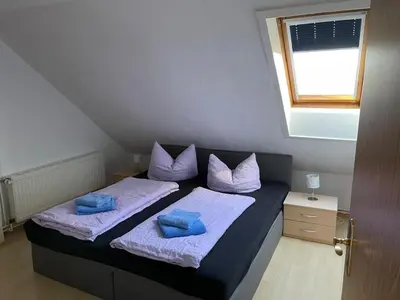 Ein Bett oder Betten in einem Zimmer der Unterkunft Ferienwohnung Kreft