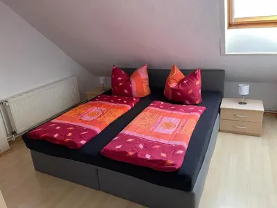 Ein Bett oder Betten in einem Zimmer der Unterkunft Ferienwohnung Kreft