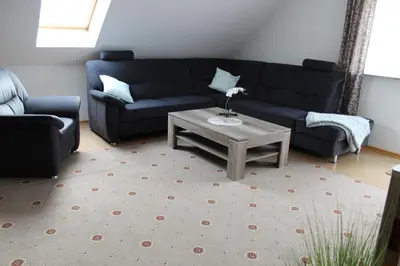 Ein Sitzbereich in der Unterkunft Ferienwohnung Vier Sterne