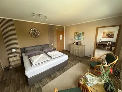 Ein Bett oder Betten in einem Zimmer der Unterkunft Ferienwohnung Quedlinburg OT Gernrode Harz