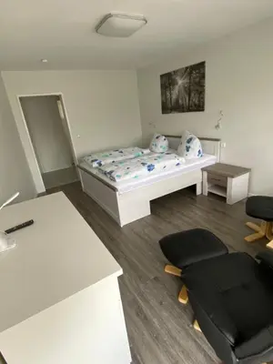 Ein Bett oder Betten in einem Zimmer der Unterkunft Hotel Braunlage