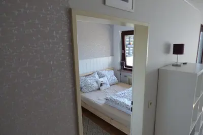 Ein Bett oder Betten in einem Zimmer der Unterkunft Familien Ferienwohnung Harzer Schöllchen