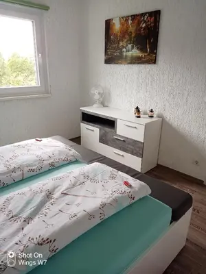 Ein Bett oder Betten in einem Zimmer der Unterkunft Ferienhaus Mina im Harz