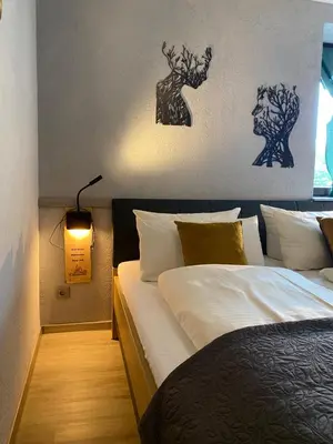 Ein Bett oder Betten in einem Zimmer der Unterkunft Hotel & Restaurant Druidenstein