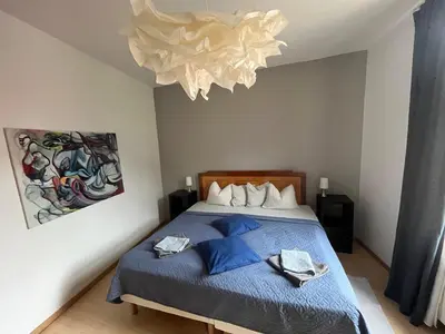 Ein Bett oder Betten in einem Zimmer der Unterkunft Art Apartment - Harz