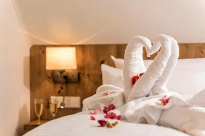 Ein Bett oder Betten in einem Zimmer der Unterkunft Torfhaus Harzresort