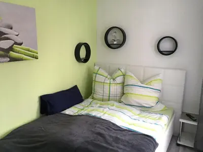 Ein Bett oder Betten in einem Zimmer der Unterkunft Hahnenklee Ferienpark 6-244
