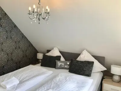 Ein Bett oder Betten in einem Zimmer der Unterkunft Schöne Bergsicht