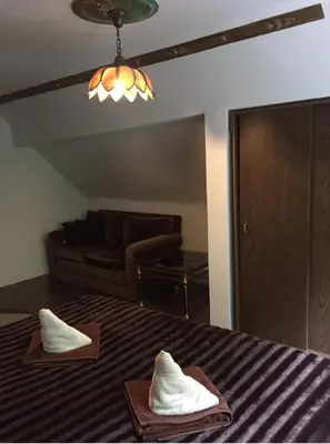 Ein Bett oder Betten in einem Zimmer der Unterkunft Königreich Romkerhall
