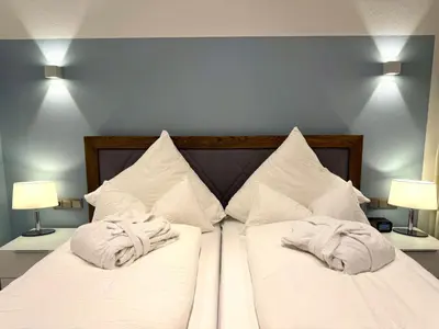 Ein Bett oder Betten in einem Zimmer der Unterkunft 4-Sterne Premiumferienwohnung Köhnke 3 - [#122258]