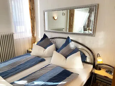 Ein Bett oder Betten in einem Zimmer der Unterkunft 3-Sterne Komfortferienwohnung Köhnke 6 - [#122261]