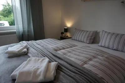 Ein Bett oder Betten in einem Zimmer der Unterkunft Ferienhaus Hundertmorgenfeld Wo2