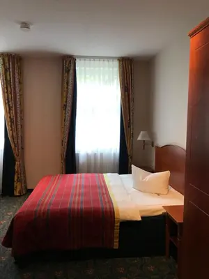 Ein Bett oder Betten in einem Zimmer der Unterkunft Hotel Johannishof