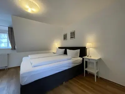 Ein Bett oder Betten in einem Zimmer der Unterkunft Apartment mit Balkon No4