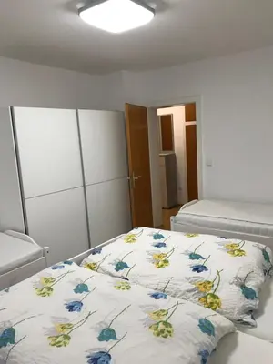 Ein Bett oder Betten in einem Zimmer der Unterkunft Am Hirschwald