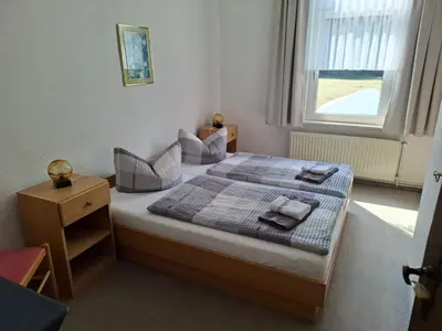 Ein Bett oder Betten in einem Zimmer der Unterkunft Pension Bodetal