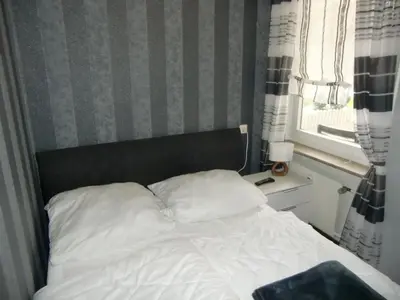 Ein Bett oder Betten in einem Zimmer der Unterkunft Schickeria