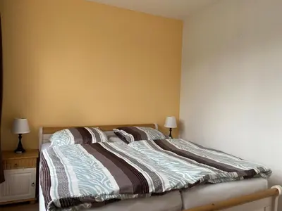 Ein Bett oder Betten in einem Zimmer der Unterkunft Ferienwohnungen mit Weitblick