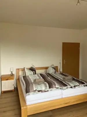 Ein Bett oder Betten in einem Zimmer der Unterkunft Ferienwohnungen mit Weitblick