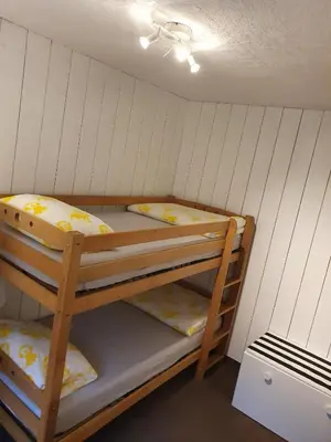 Ein Bett oder Betten in einem Zimmer der Unterkunft Luchshütte