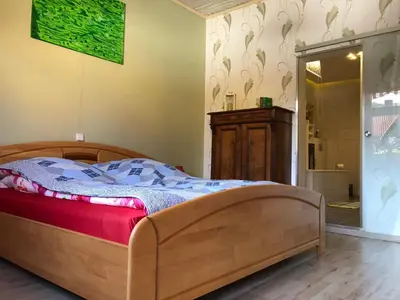 Ein Bett oder Betten in einem Zimmer der Unterkunft Ferienwohnung Harzerfuchs